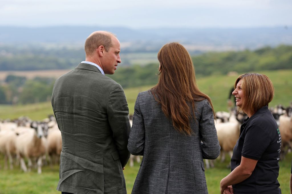 william and kate chatting to emily stables next to flock of sheep 