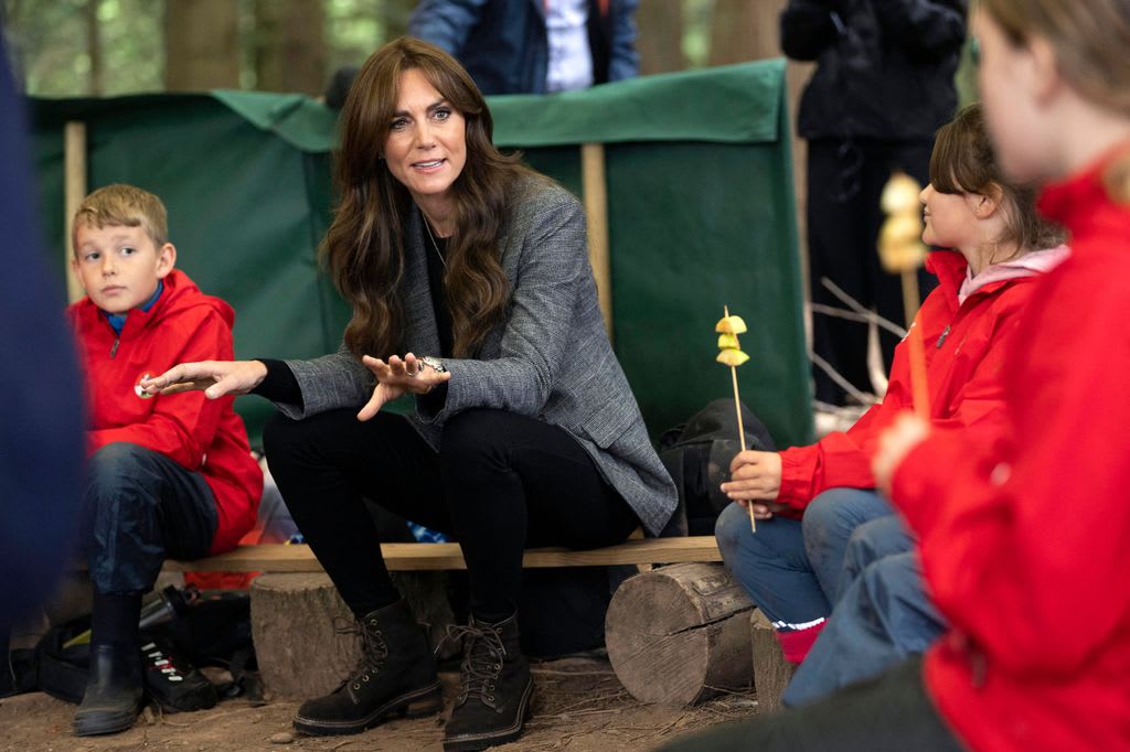 princess kate sat around campfire