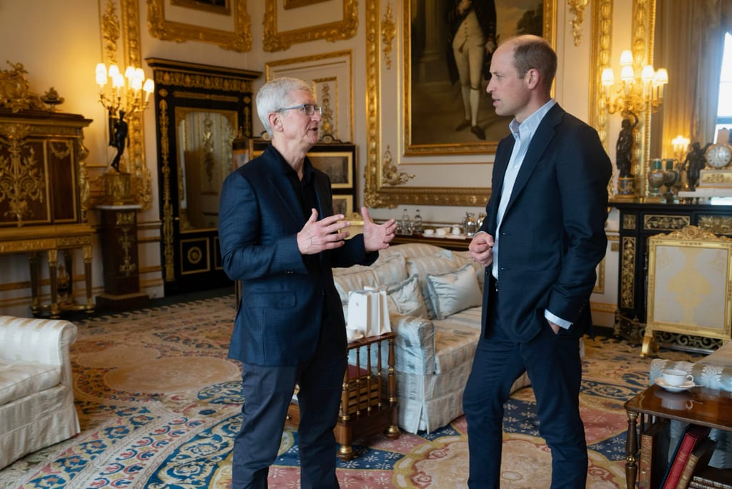 Apple Managing Director Tim Cook talking to Prince William at Buckingham Palace