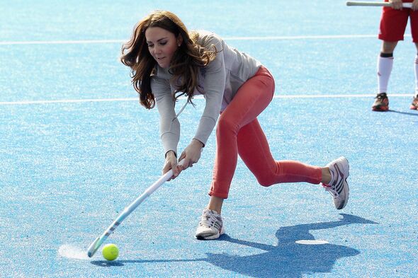 Kate running with a hockey stick