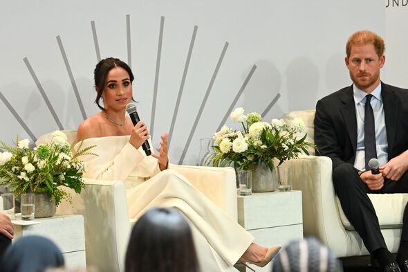 Harry and Meghan speak onstage at Archewell summit