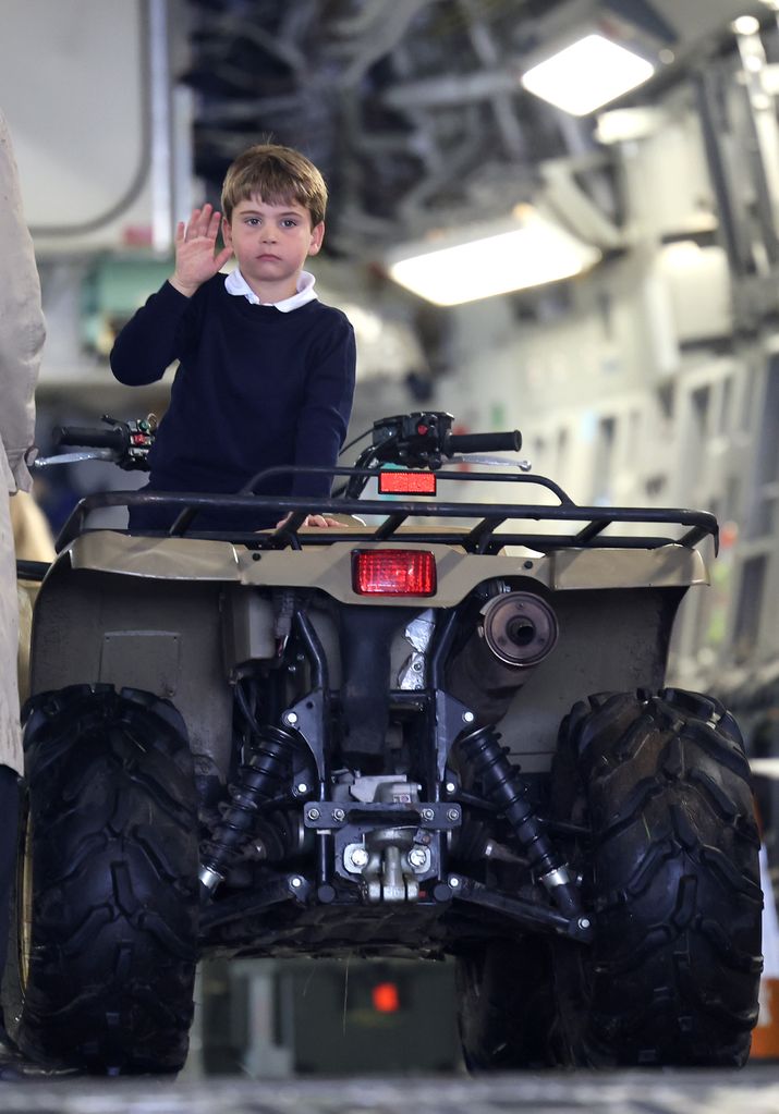 Prince Louis of Wales sits inside a vehicle on a C17 plane 