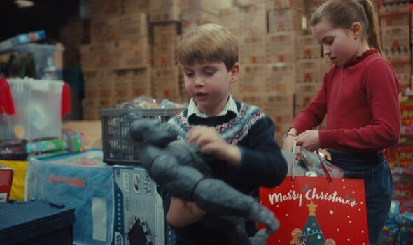 prince louis and princess charlotte helping to pack christmas presents
