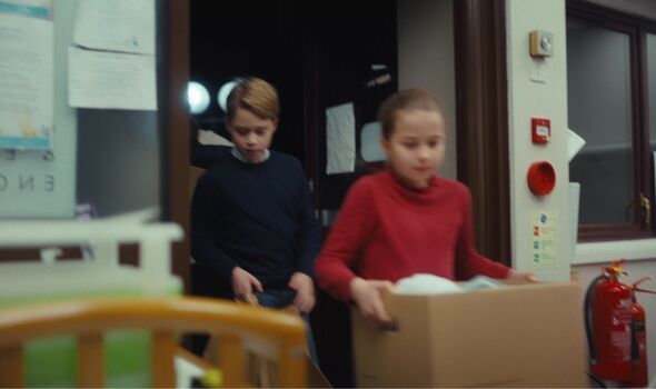 prince george and princess charlotte carry boxes