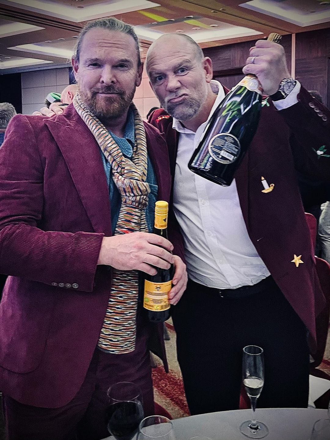 Mike Tindall in a burgundy jacket embroidered with Christmas motifs 