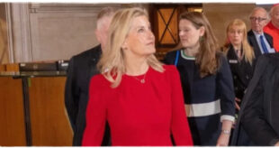 Duchess Sophie wearing a waist-cinching scarlet dress during a royal appearance