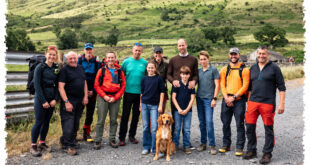 Prince William and Princess Kate posing with Prince George, Princess Charlotte, Prince Louis and mountain rescue volunteers in a previously unseen family photograph